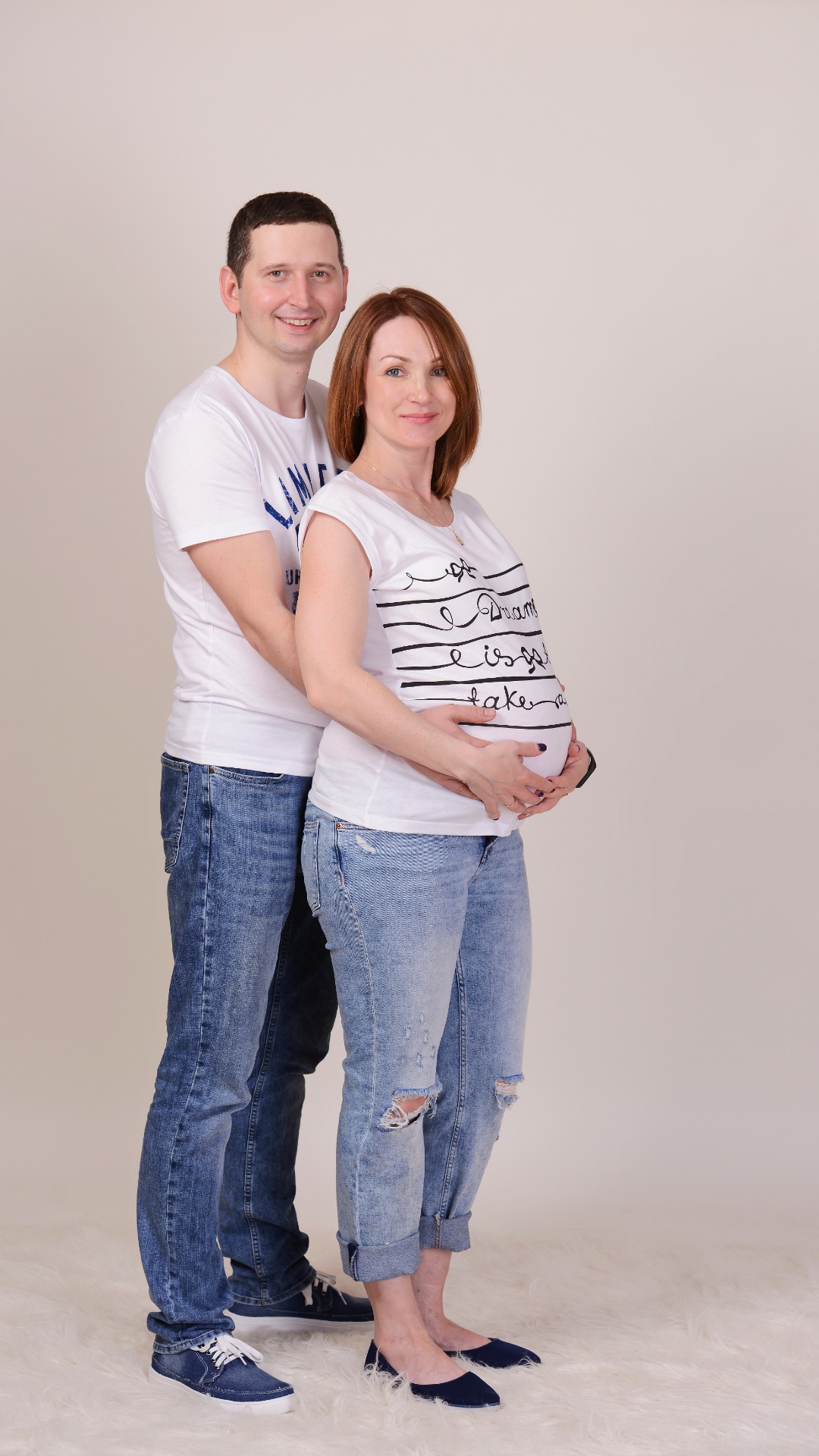 Create a video while maintaining the appearance of the man and woman. The woman turns around, pul...