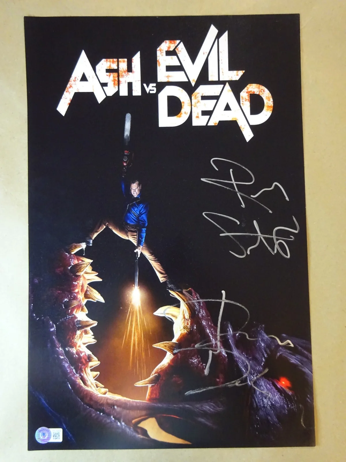 Ray Santiago & Dana DeLorenzo — Signed Ray Santiago & Dana DeLorenzo Ash Vs Evil Dead 11"x17" Photo Beckett COA