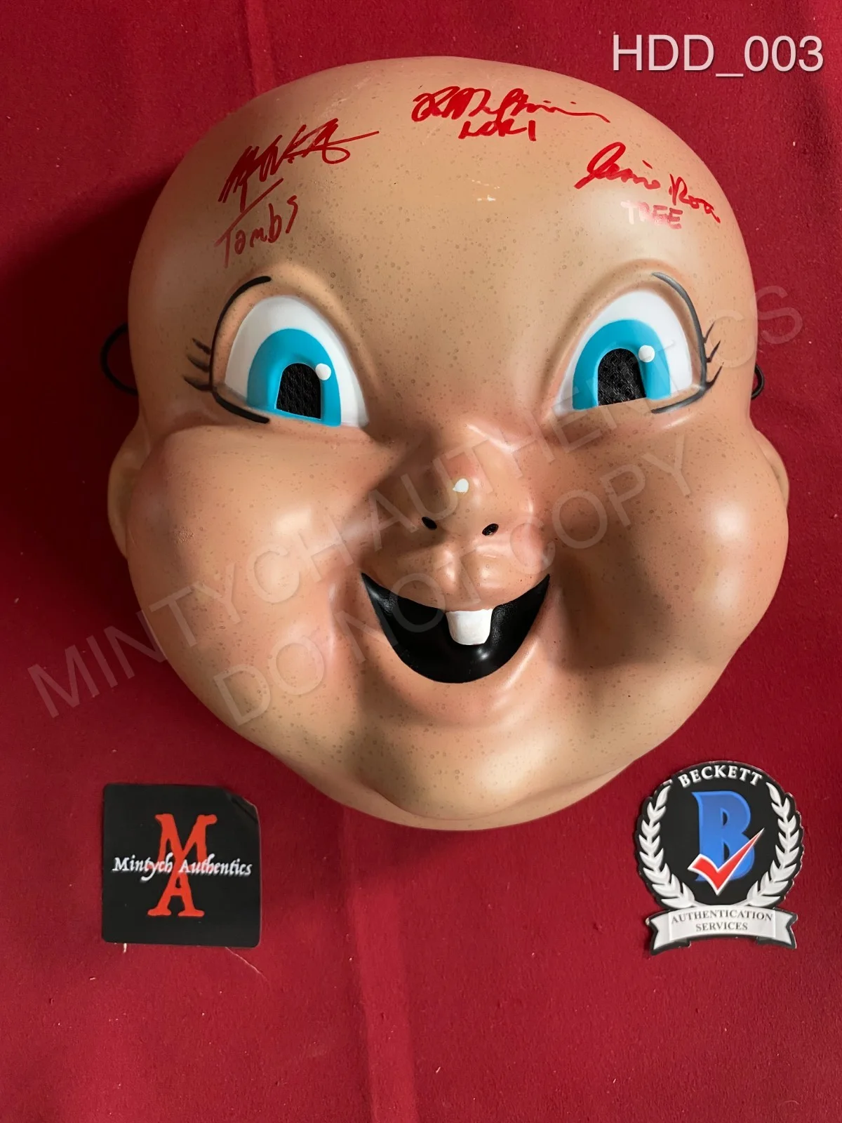 Jessica Rothe & Rob Mello, Ruby Modine — Happy Death Day cast signed baby mask Jessica Rothe Ruby Modine Rob Mello
