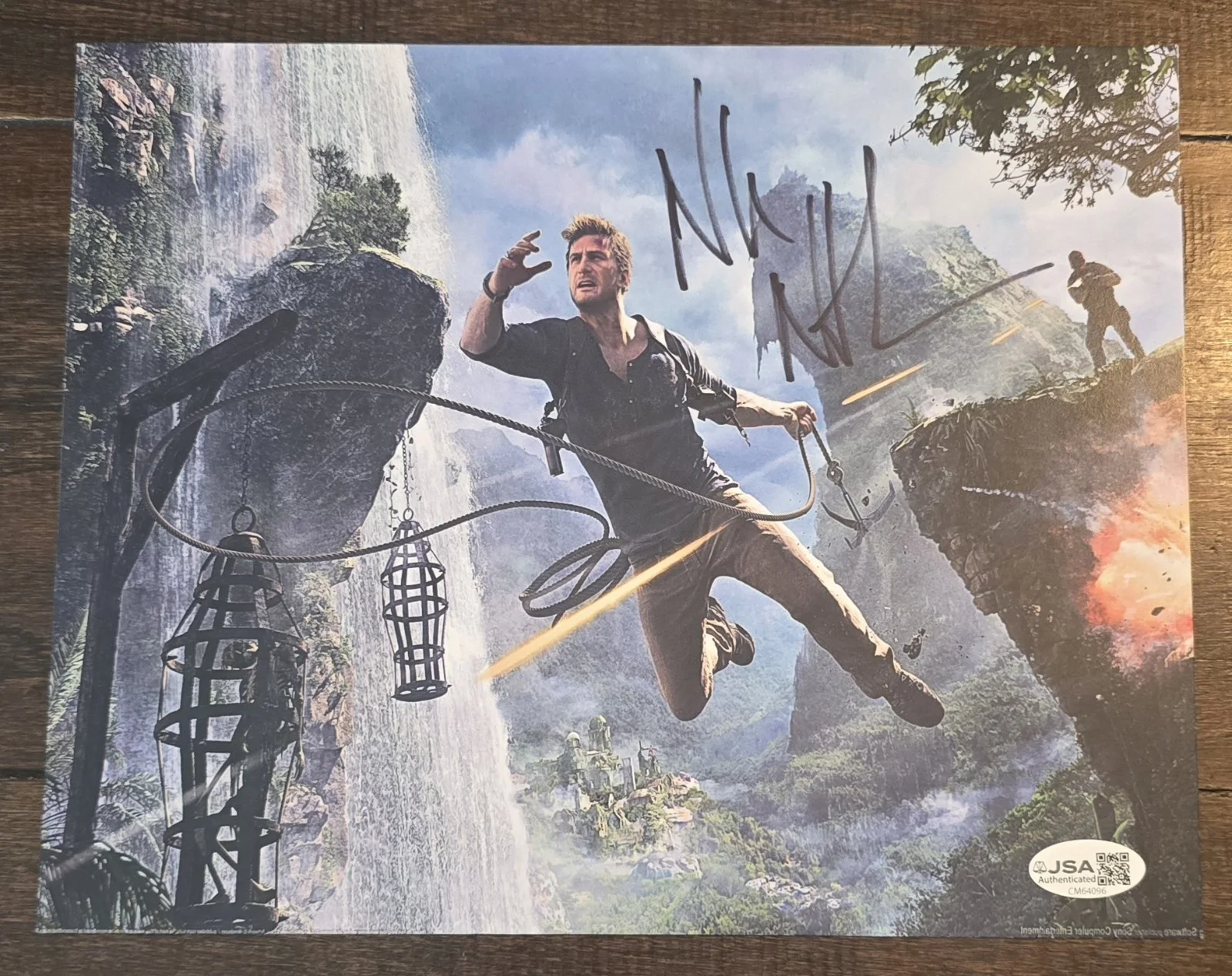 Nolan North — Nolan North signed Nathan Drake Uncharted 8x10 picture. Comes with JSA...