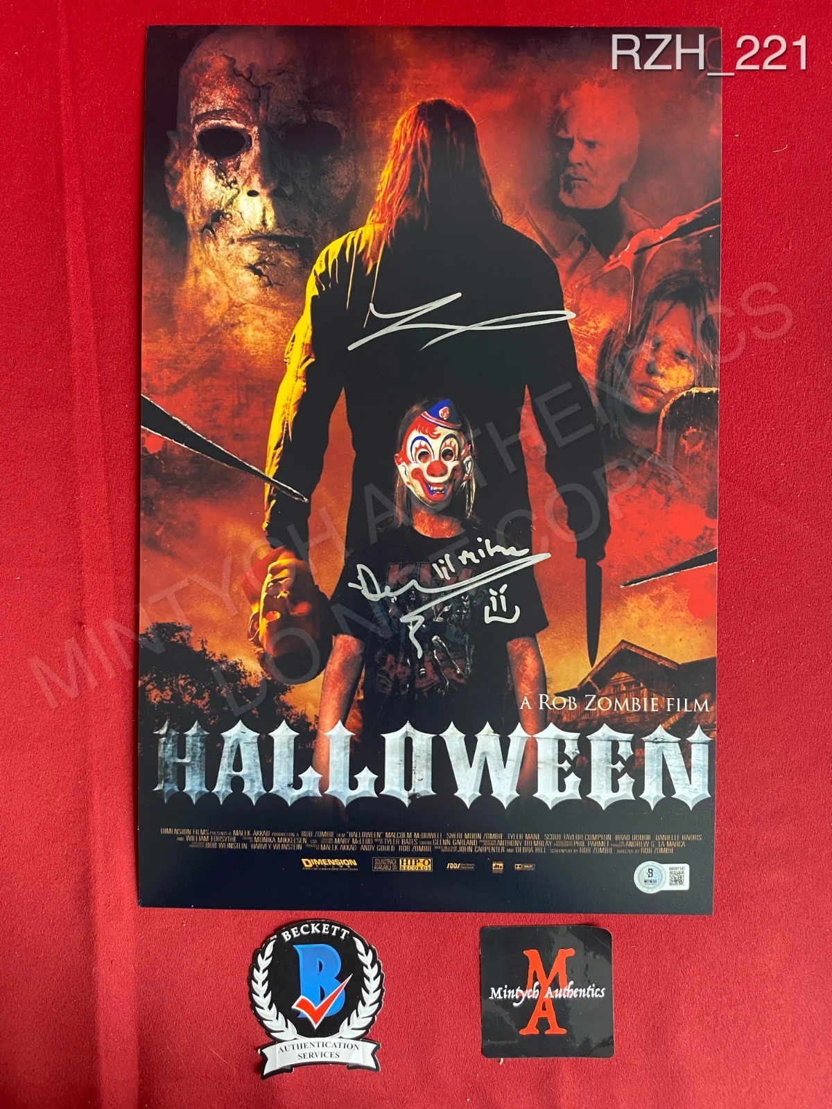 Daeg Faerch, Tyler Mane — Daeg Faerch Tyler Mane dual signed 11x17 photo Rob Zombie Halloween Beckett