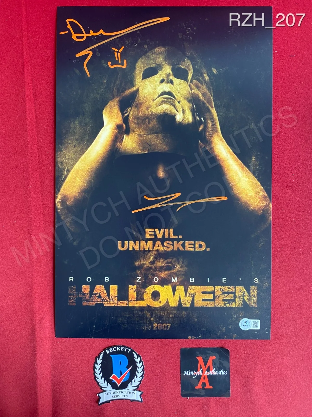 Daeg Faerch, Tyler Mane — Daeg Faerch Tyler Mane dual signed 11x17 photo Rob Zombie Halloween Beckett