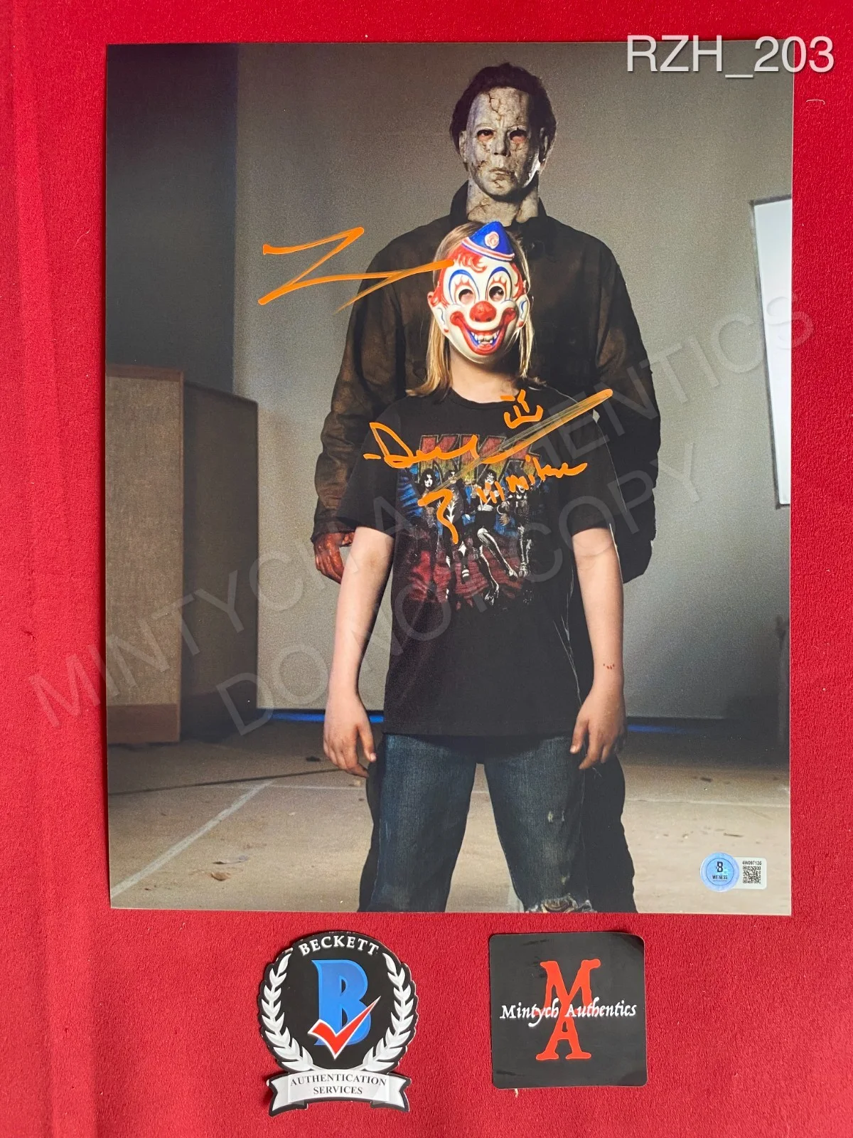 Daeg Faerch, Tyler Mane — Daeg Faerch Tyler Mane dual signed 11x14 photo Rob Zombie Halloween Beckett