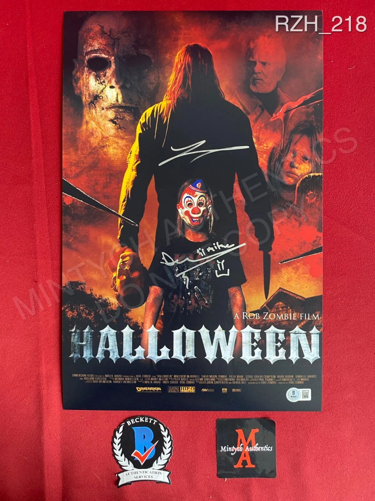 Daeg Faerch, Tyler Mane — Daeg Faerch Tyler Mane dual signed 11x17 photo Rob Zombie Halloween Beckett
