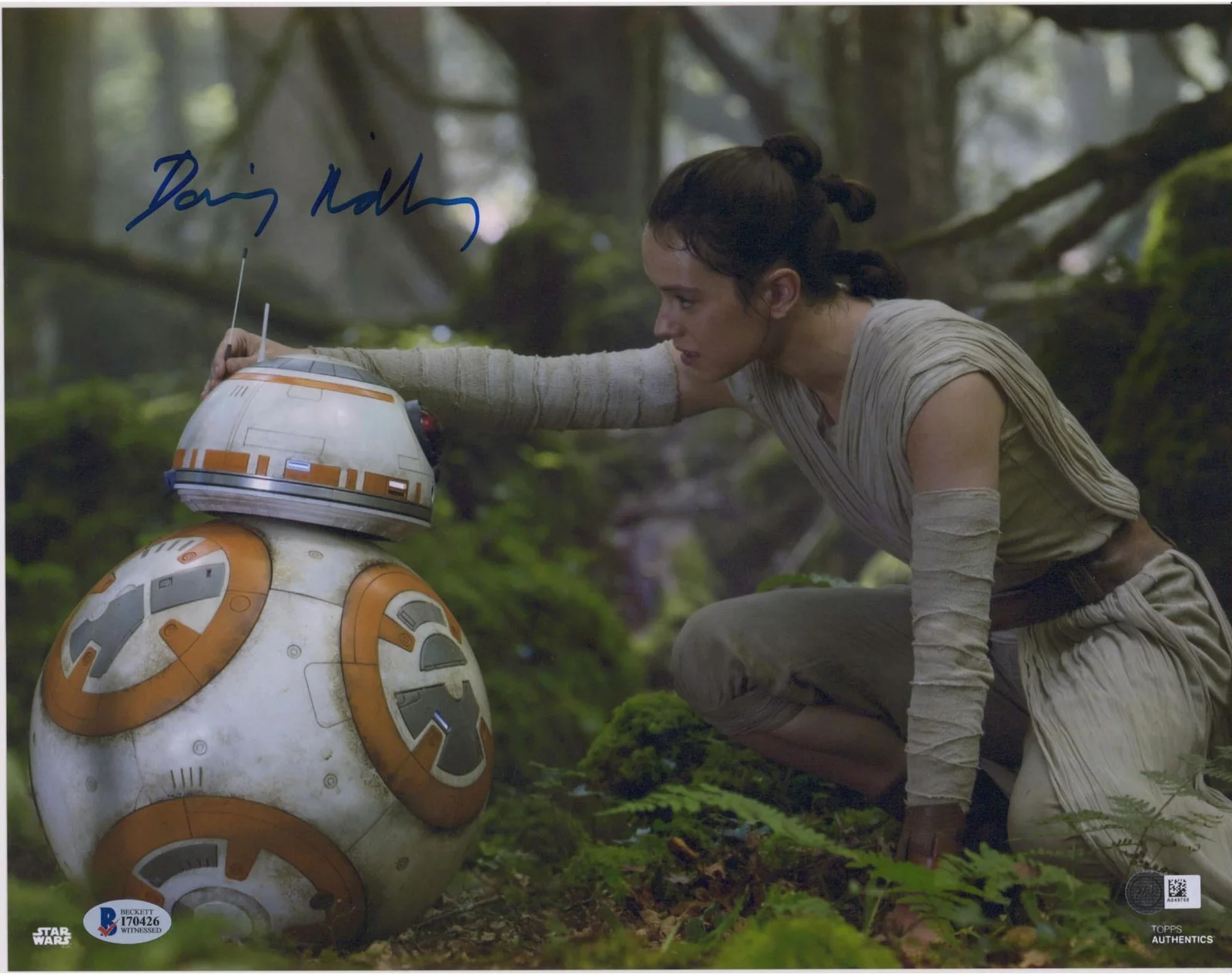 Daisy Ridley — Daisy Ridley The Last Jedi Autographed 12" x 18" with BB-8 Photograph BAS