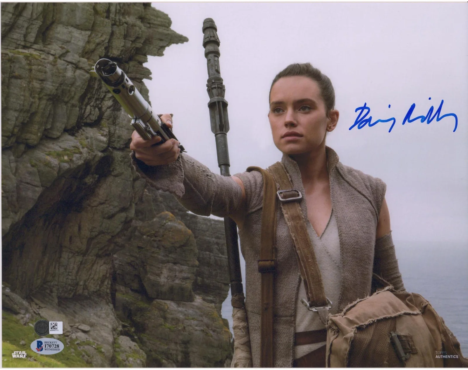 Daisy Ridley — Daisy Ridley The Force Awakens Signed 12" x 18" Holding Light Saber Photo - BAS