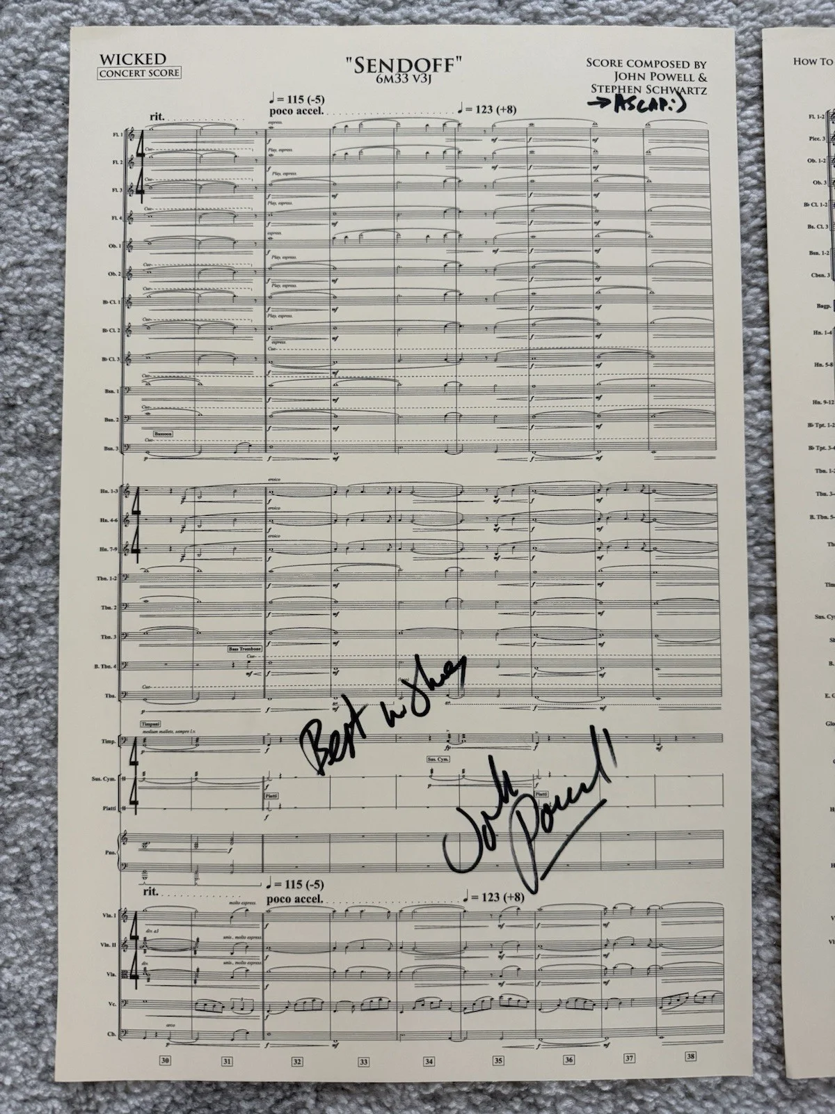 John Powell — John Powell Signed Score Page (Wicked) (CharityBuzz COA)