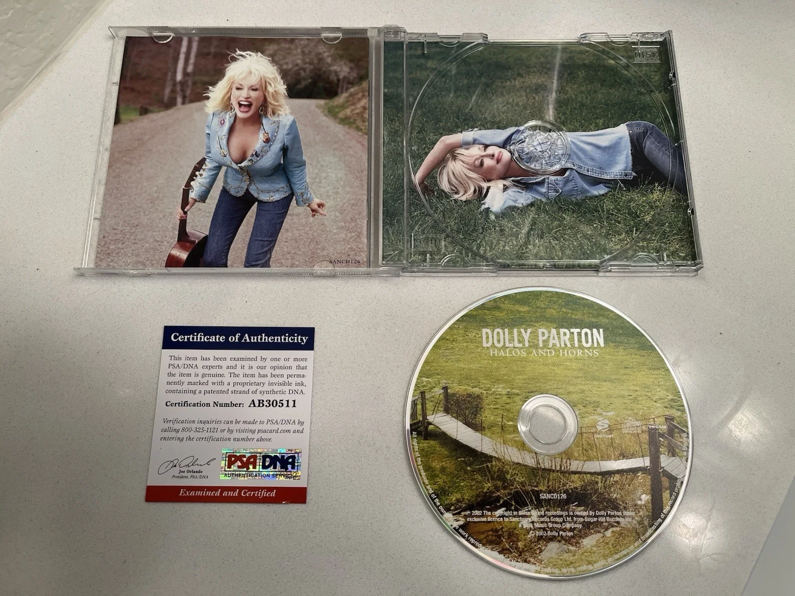 PRISTINE DOLLY PARTON SIGNED PSA HALOS & HORNS CD AUTOGRAPH MINT!, image 4