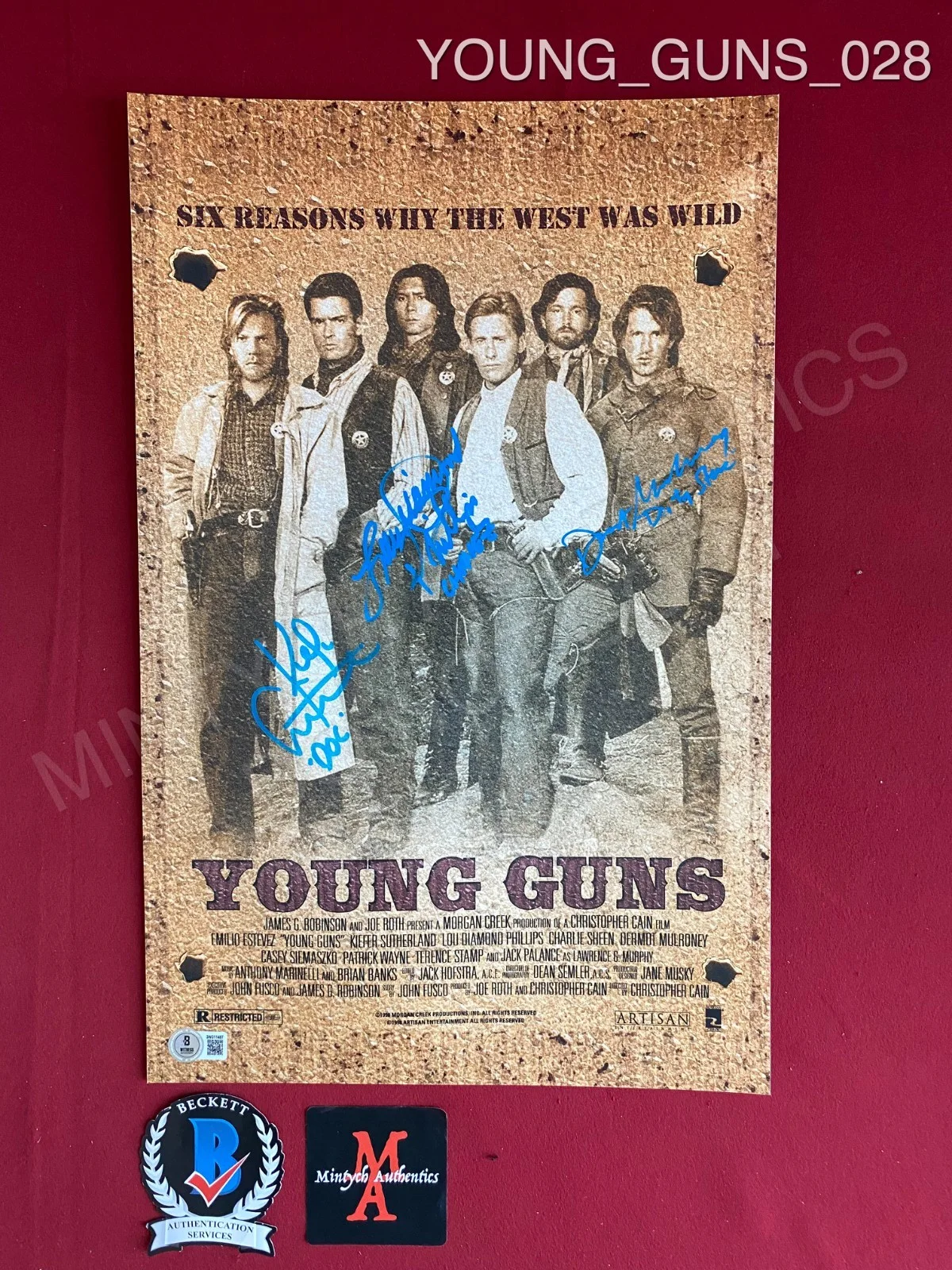 Dermot Mulroney, Kiefer Sutherland, Lou Diamond Phillips — Young Guns cast signed 11x17 photo Beckett Sutherland Mulroney Phillips