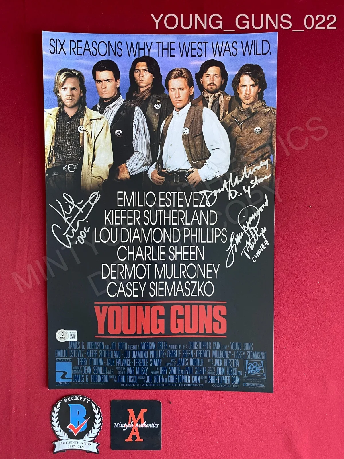 Dermot Mulroney, Kiefer Sutherland, Lou Diamond Phillips — Young Guns cast signed 11x17 photo Beckett Sutherland Mulroney Phillips