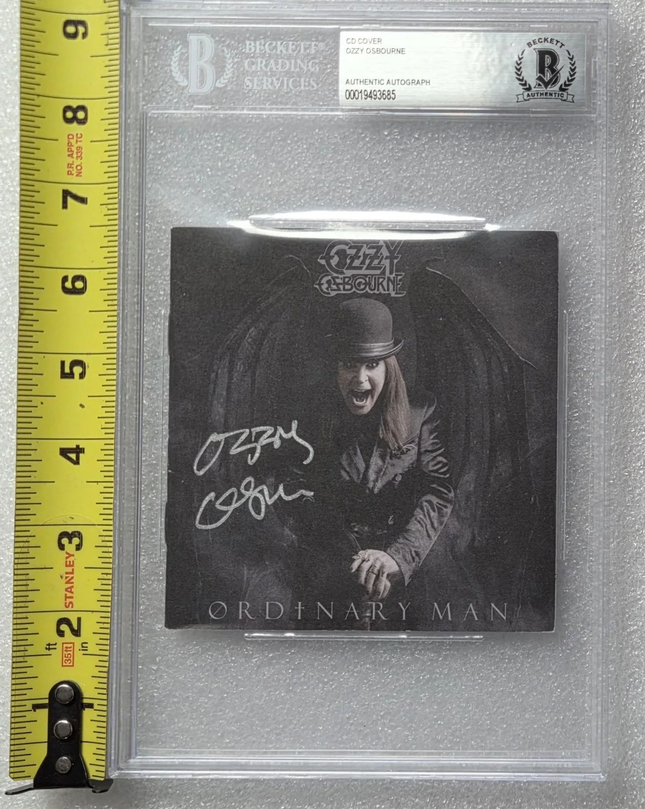 OZZY OSBOURNE SIGNED CD COVER BECKETT BAS COA AUTOGRAPHED SLABBED ORDINARY MAN, image 2