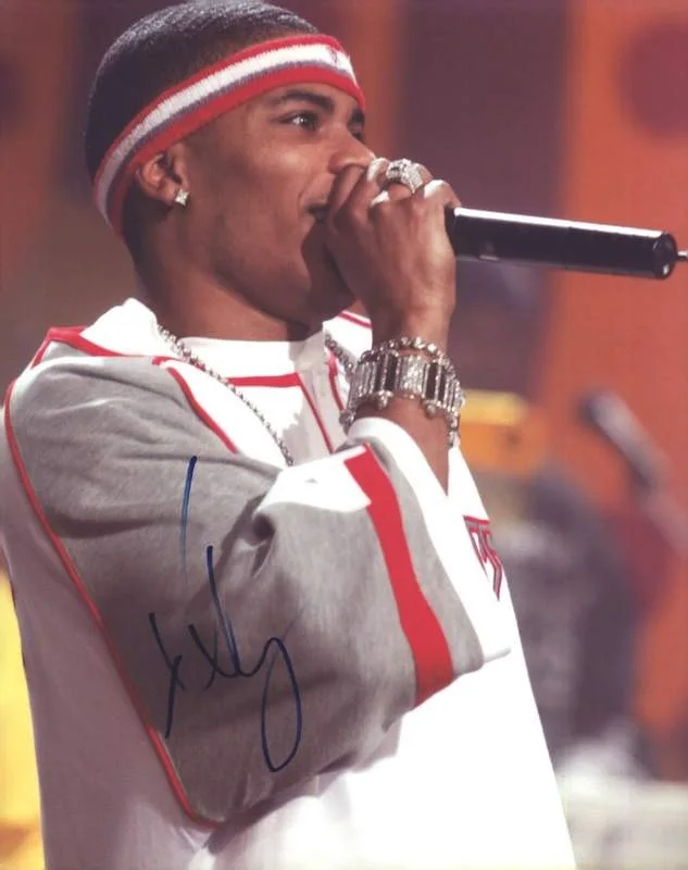 Nelly — Nelly Nell authentic signed rap 8x10 photo W/Certificate Autographed (A0990)