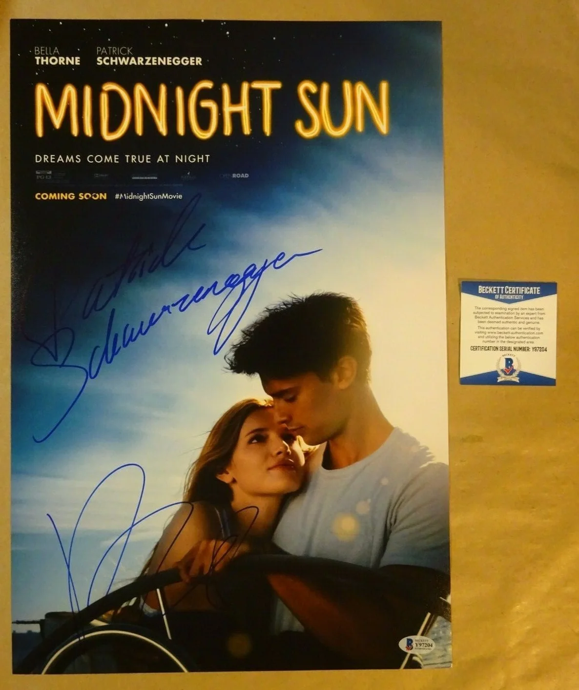 Bella Thorne & Patrick Schwarzenegger — Signed BELLA THORNE & SCHWARZENEGGER MIDNIGHT SUN 12"x18" Photo BECKETT BAS COA