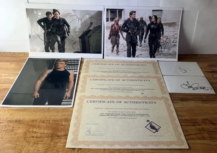 Jennifer Lawrence — The Hunger Games Signed Photograph Lot - 2 Jennifer Lawrence/Liam Hemsworth COA