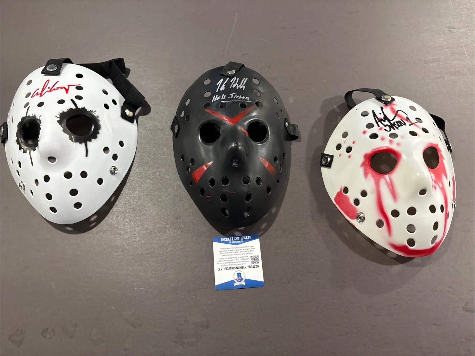 Kane Hodder, Alice Cooper, Ari Lehman — Alice Cooper-Kane Hodder-Ari Lehman Signed Replica Friday the 13th Masks-Beckett, image 2