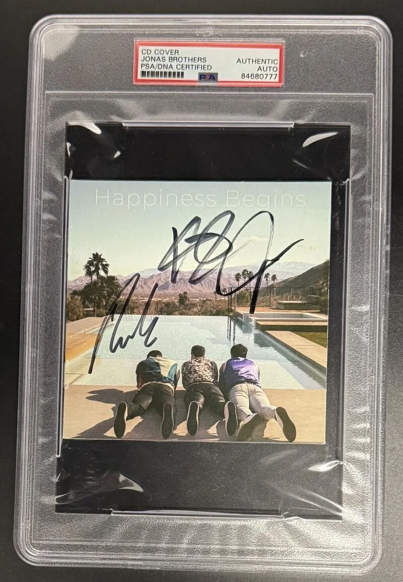 Joe Jonas, Kevin Jonas, Nick Jonas — Jonas Brothers Signed Autograph PSA/DNA Slabbed Happiness Begins CD Cover COA