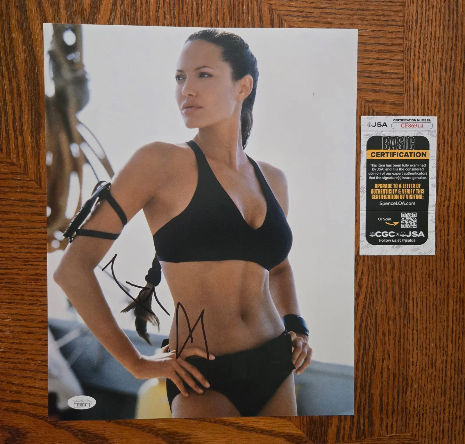 Angelina Jolie — Angelina Jolie Signed Tomb Raider 11x14 (JSA COA)