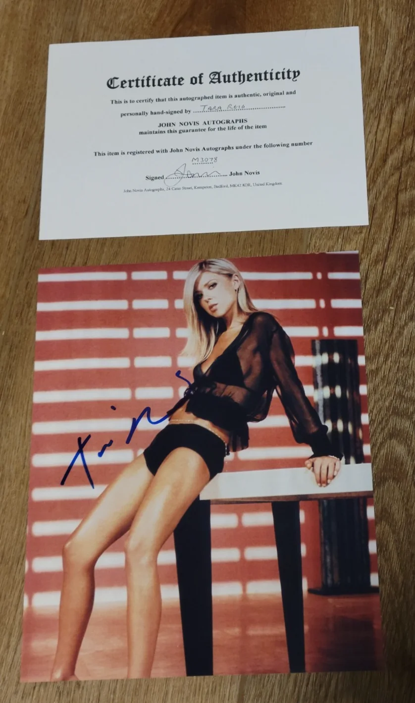 Tara Reid — Tara Reid Laying back on a table Signed Sexy Woman