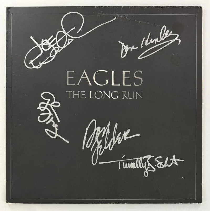 Don Felder, Glenn Frey, Don Henley, Timothy B Schmit, Joe Walsh — Eagles Full Band Signed Autograph Album Don Henley Glenn Frey Joe Walsh PSA COA