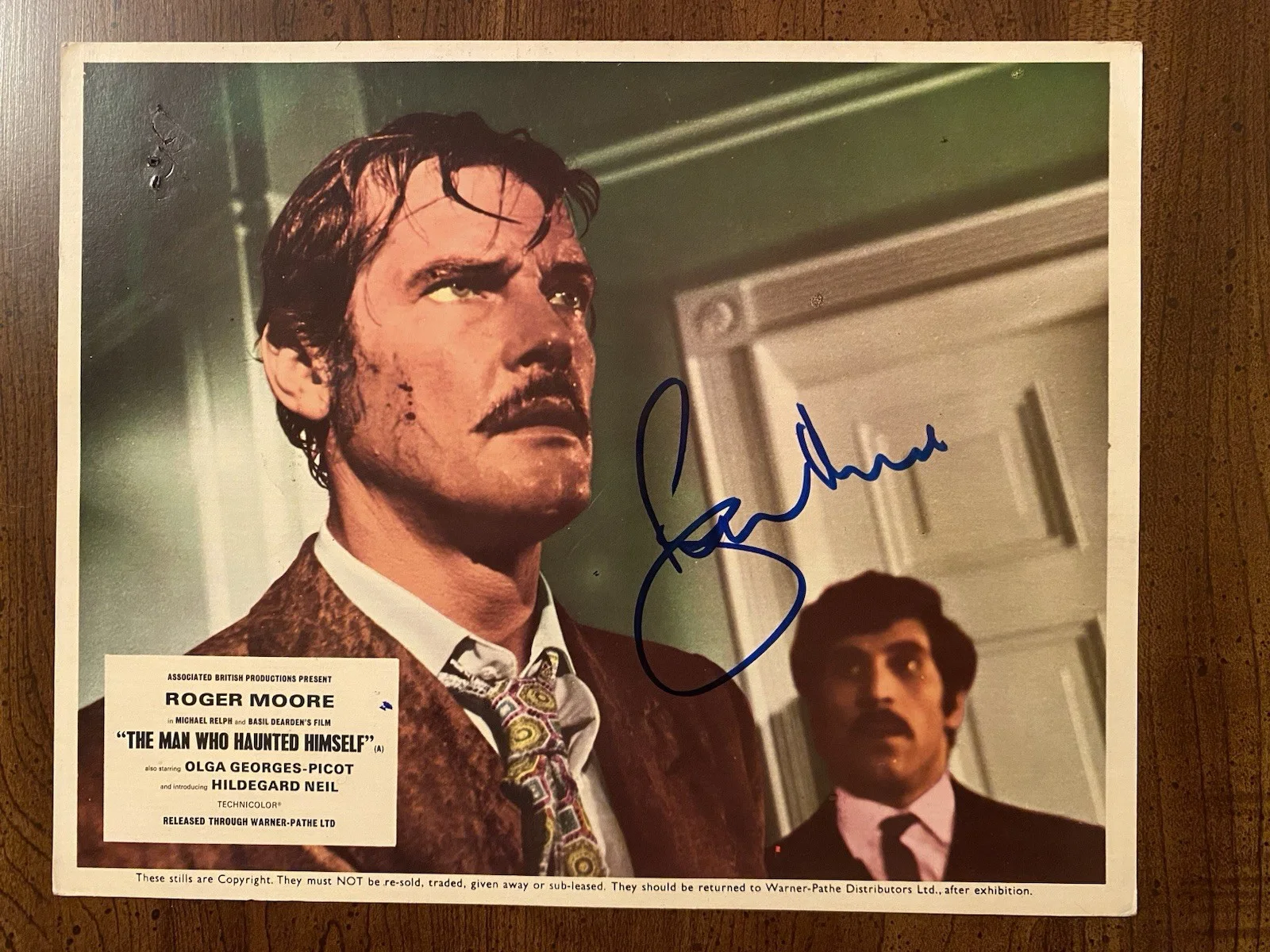 Roger Moore — Roger Moore Signed Autographed Photo With COA The Man Who Haunted Himself