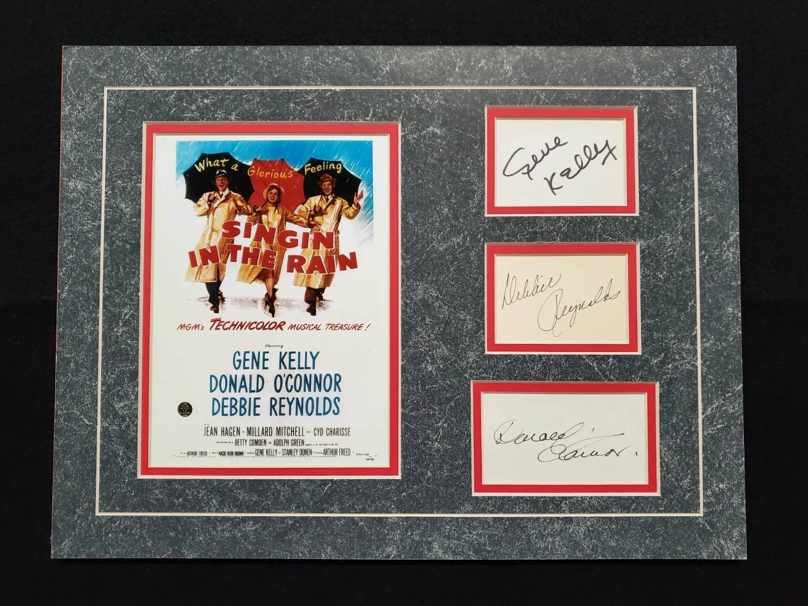 Gene Kelly, Debbie Reynolds, Donald O'Connor — Gene Kelly, Debbie Reynolds, Donald OConnor SINGIN IN THE RAIN Autograph Display