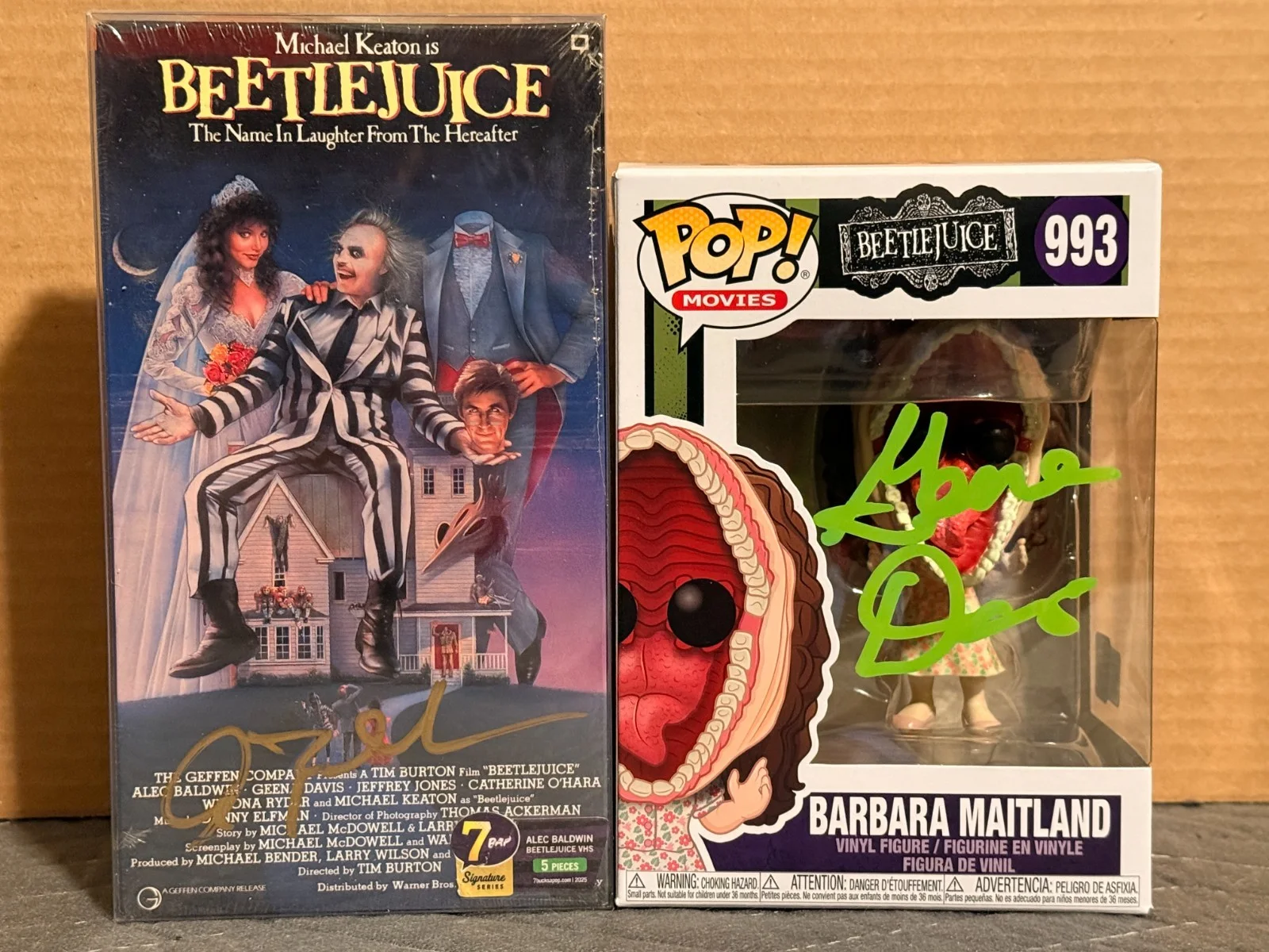 Geena Davis & Alec Baldwin — Beetlejuice Funko & VHS Set Signed By Geena Davis & Alec Baldwin JSA OC COA