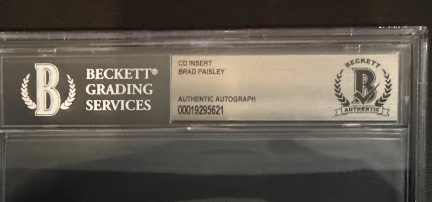 Brad Paisley SIGNED CD Insert “Snow Globe Town” - Beckett BAS Encased Slab, image 3