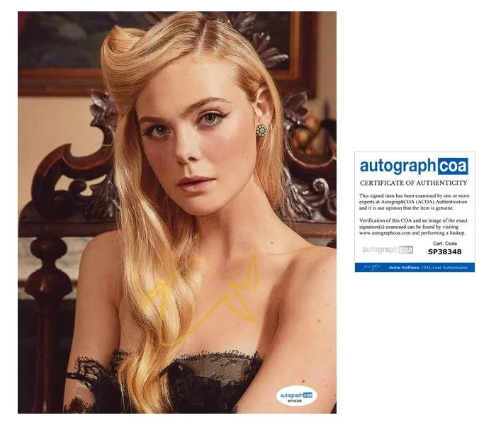 Elle Fanning — Elle Fanning "The Hunger Games: Sunrise on the Reaping" SIGNED 8x10 Photo C ACOA