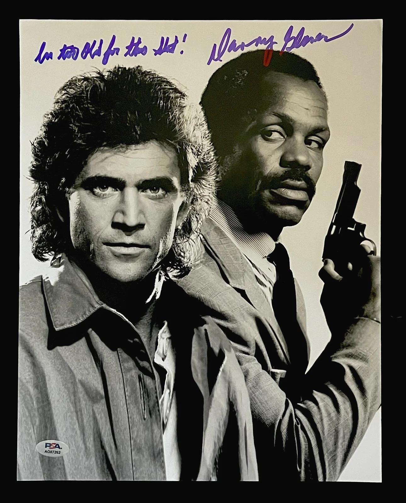DANNY GLOVER — DANNY GLOVER SIGNED GLOSSY 11X14 PHOTO W/ MEL GIBSON. PSA COA. LETHAL WEAPON T