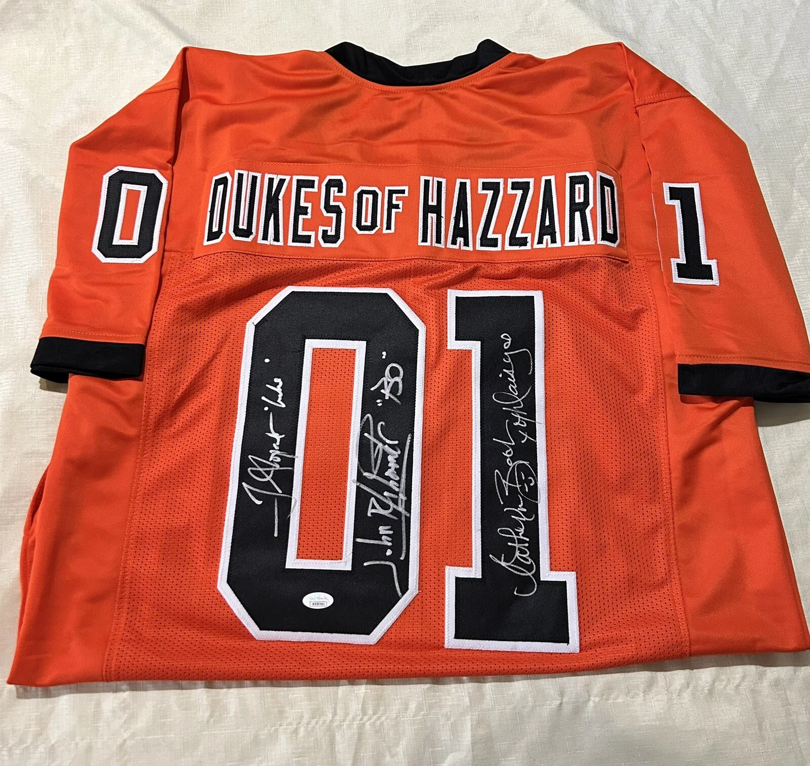 Tom Wopat, John Schneider, Catherine Bach — Catherine Bach, John Schneider, Tom Wopat Signed Dukes Of Hazzard JERSEY JSA COA