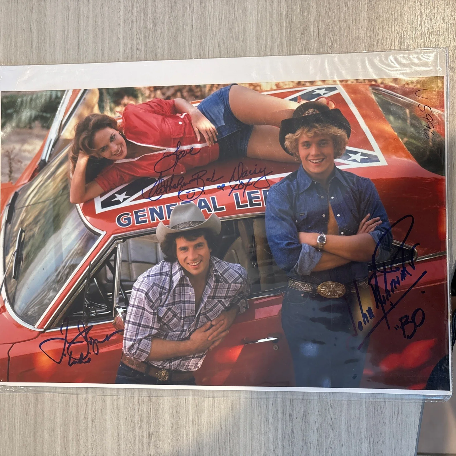 Catherine Bach, Tom Wopat, John Schneider — Dukes Of Hazzard Cast By All (3) Authentic Signed 15” x 10" Photo Mueller COA