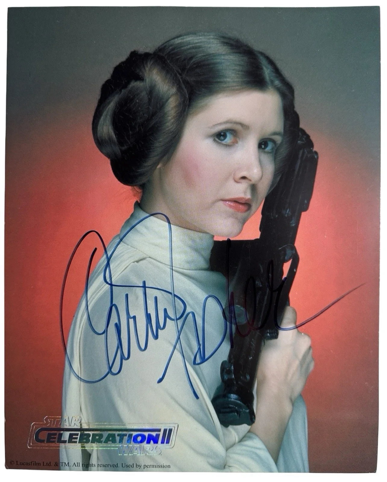 Carrie Fisher — Carrie Fisher Signed Star Wars Princess Leia Celebration II 8x10 Blaster COA/LOA