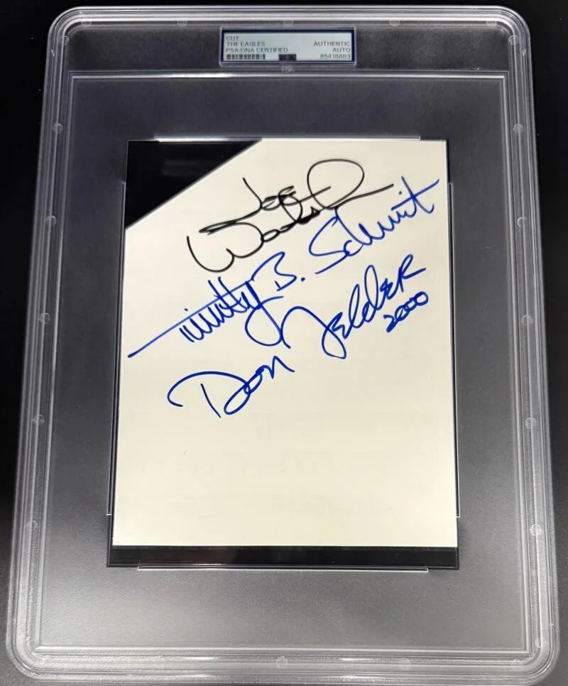 Joe Walsh, Don Felder, Timothy Schmit — The Eagles Joe Walsh Felder +1 Signed Autograph PSA/DNA Encapsulated 7x9 Cut