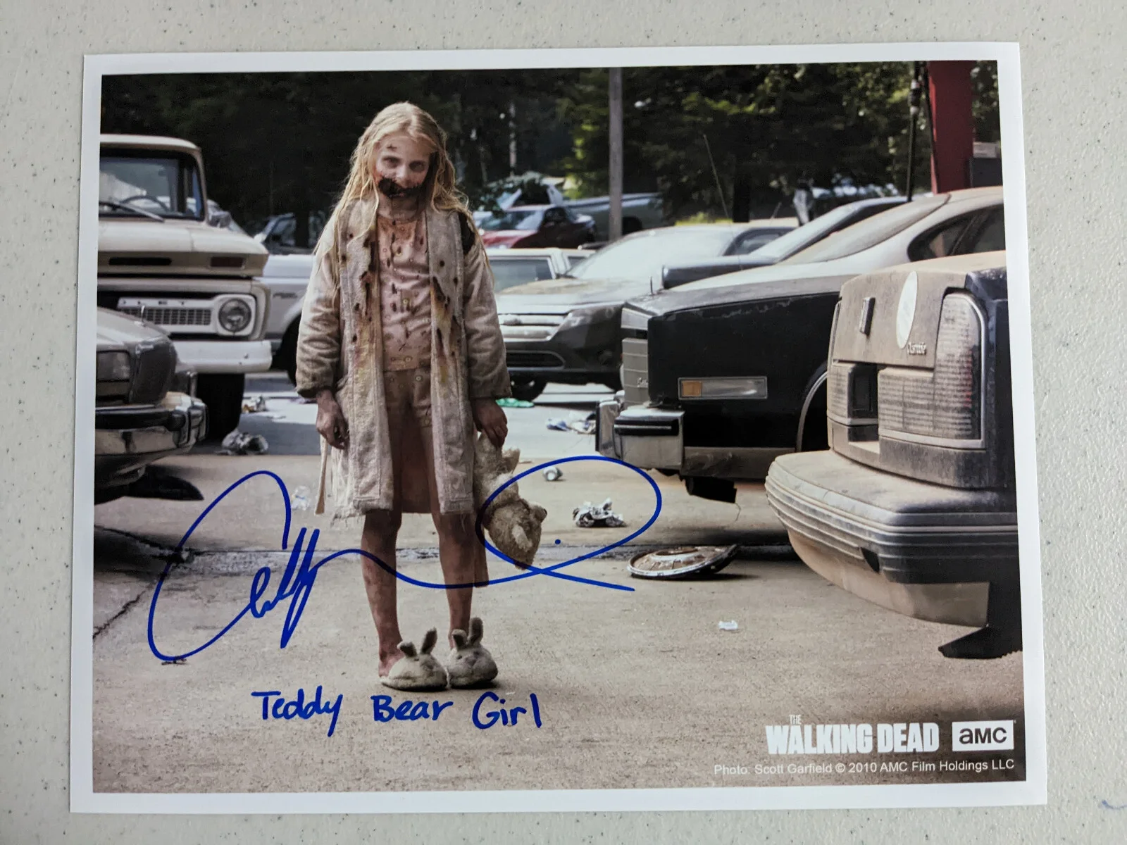 HorrorAutographs.com — ADDY MILLER Signed 8x10 Photo Teddy Bear Girl The Walking Dead Autograph JSA C