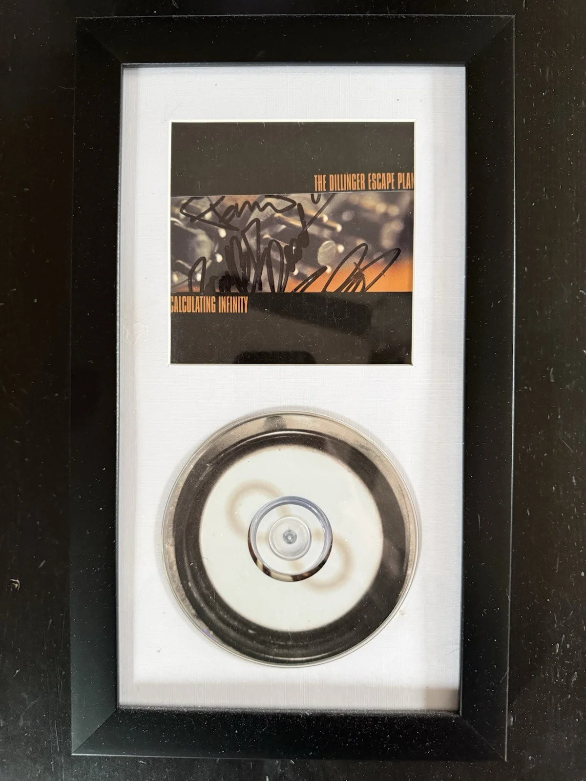 Greg Puciato, Chris Pennie, Liam Wilson, Brian Benoit — THE DILLINGER ESCAPE PLAN - SIGNED & Framed ‘Calculating Infinity’ Booklet + CD