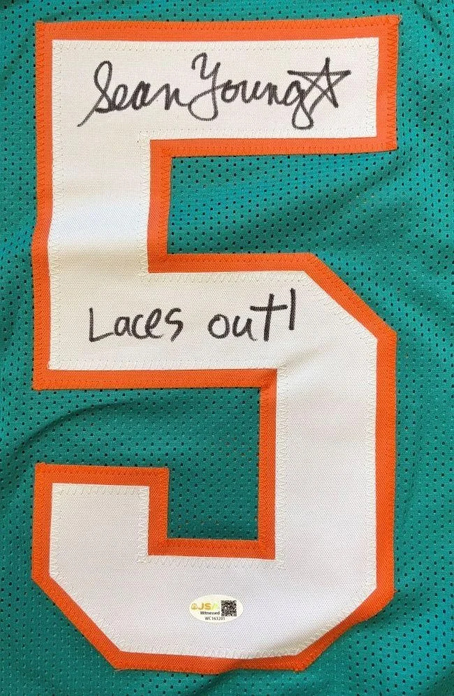 Sean Young / Lt. Lois Einhorn / Ray Finkle — Sean Young Signed Jersey Inscribed "Laces Out!" (JSA) Ace Ventura / Dolphins, изображение 2