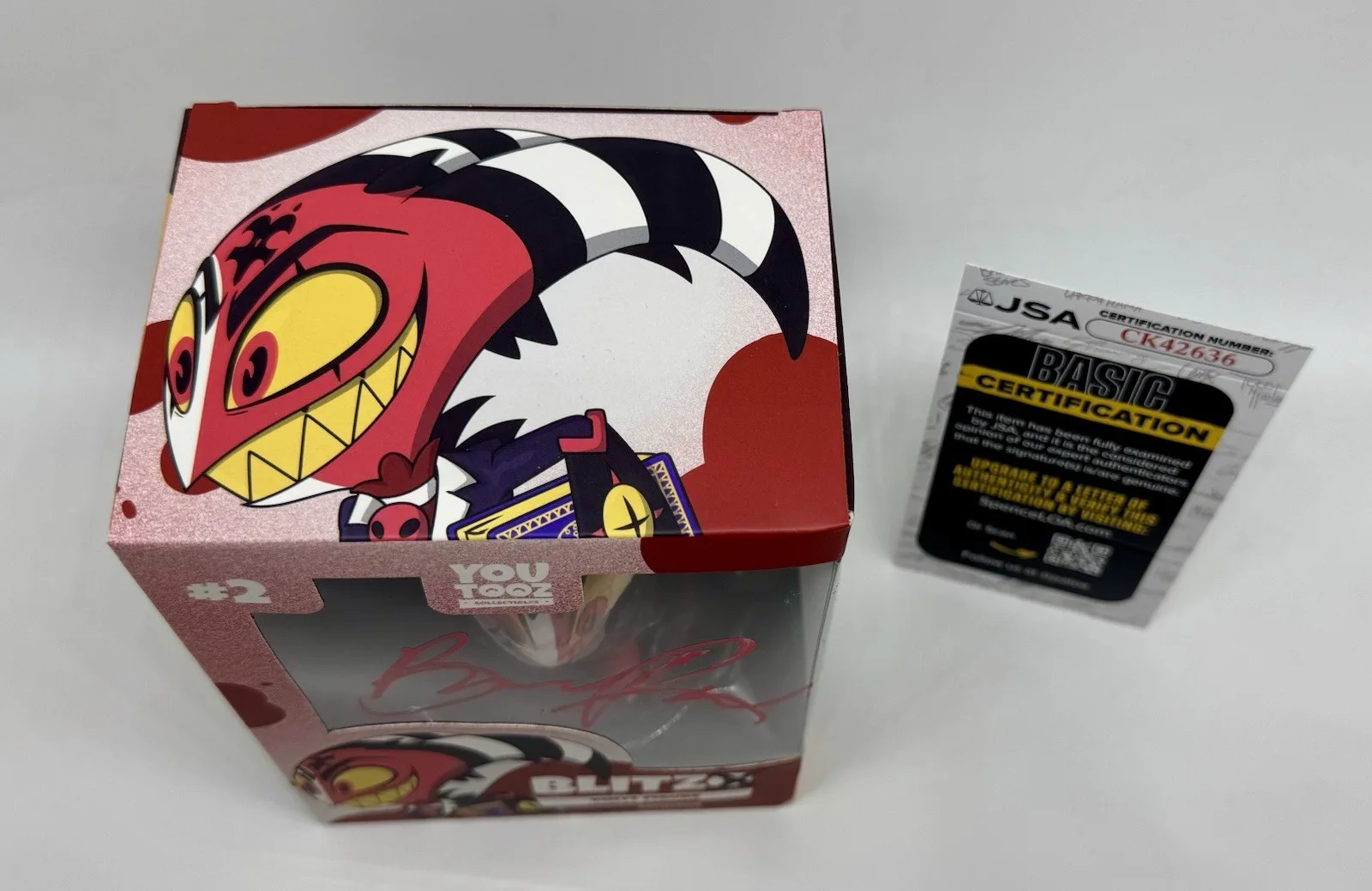 BRANDON ROGERS — BRANDON ROGERS SIGNED BLITZO YOUTOOZ VINYL FIGURE HELLUVA BOSS +JSA COA, image 2