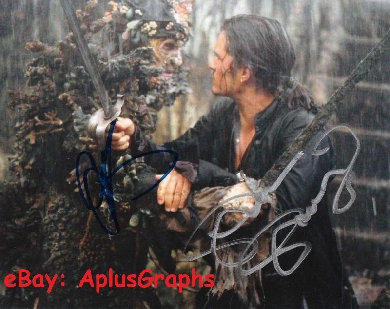 Stellan Skarsgard and Orlando Bloom — THE PIRATES OF THE CARIBBEAN: DEAD MAN'S CHEST... Bloom with Skarsgard - SIGNED