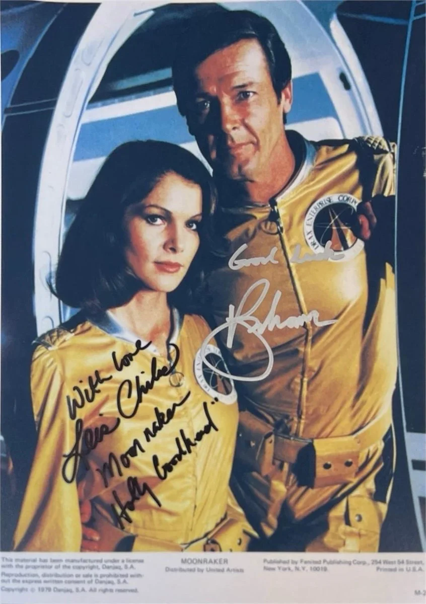Roger Moore & Lois Chiles — Roger Moore & Lois Chiles Signed 8x11.5 Moonraker Photo Autograph COA