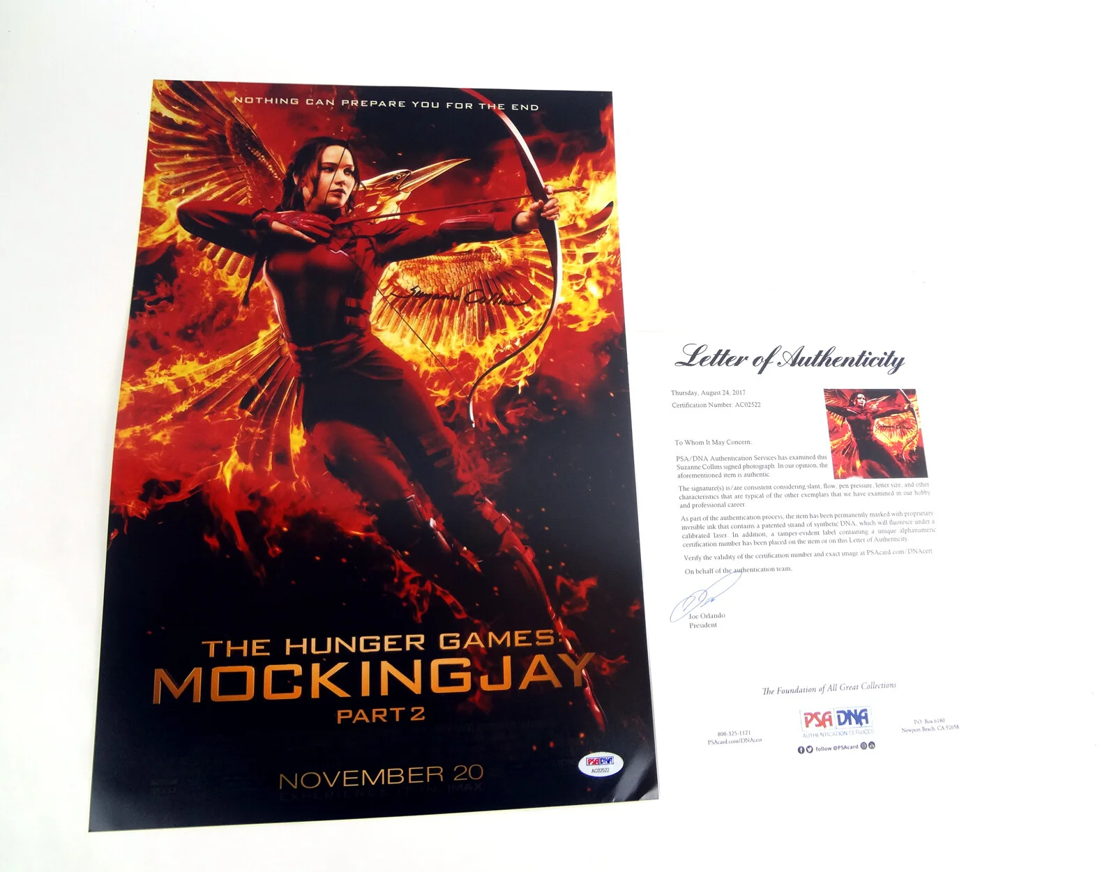 Suzanne Collins — Suzanne Collins Signed The Hunger Games Mockingjay Movie Poster PSA/DNA COA