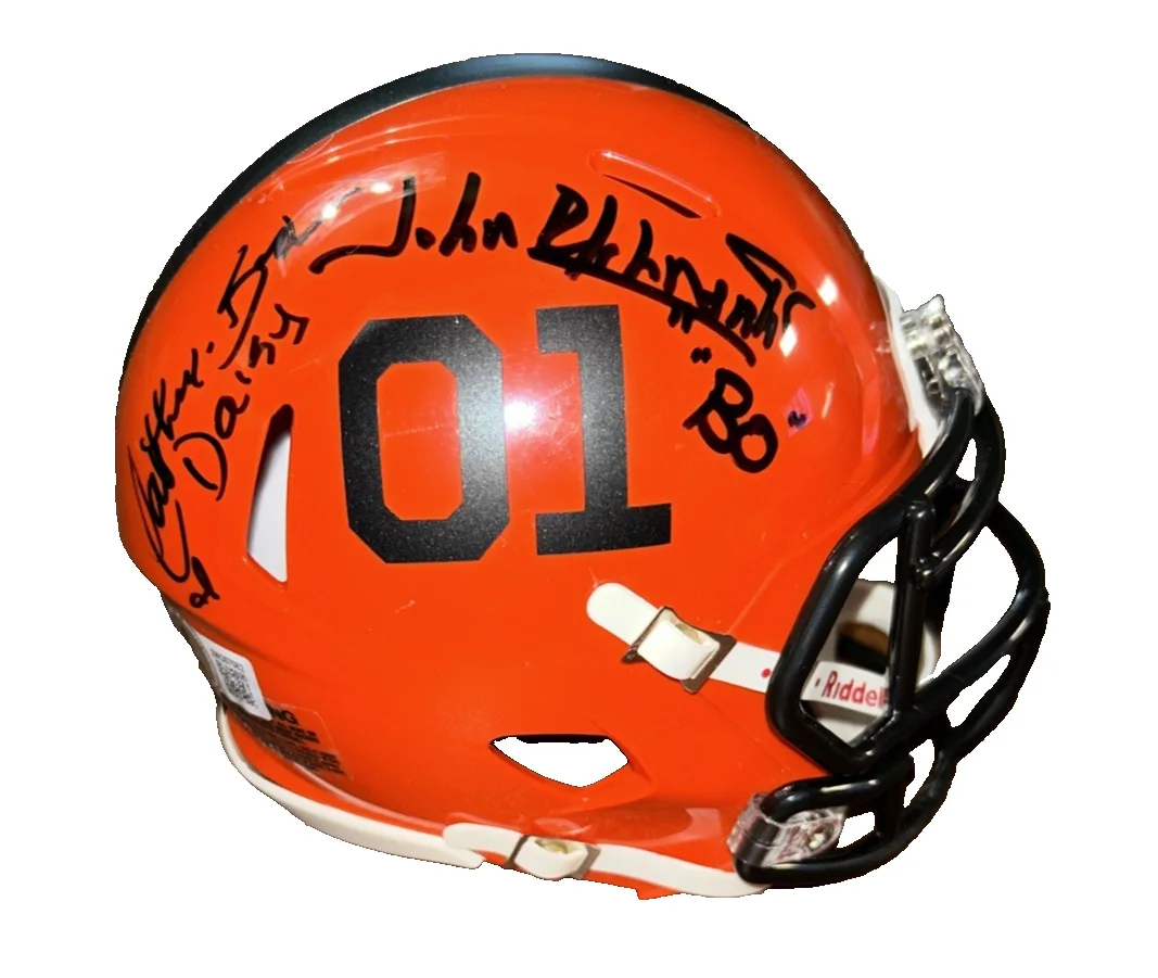 Tom Wopat, Catherine Bach & John Schneider — Catherine Bach John Schneider Tom Wopat signed General Lee Dukes Helmet Beckett