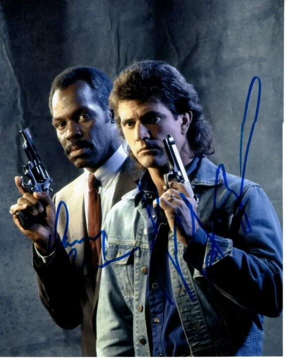 Danny Glover and Mel Gibson — Danny Glover and Mel Gibson signed 8x10 Lethal Weapon photo COA