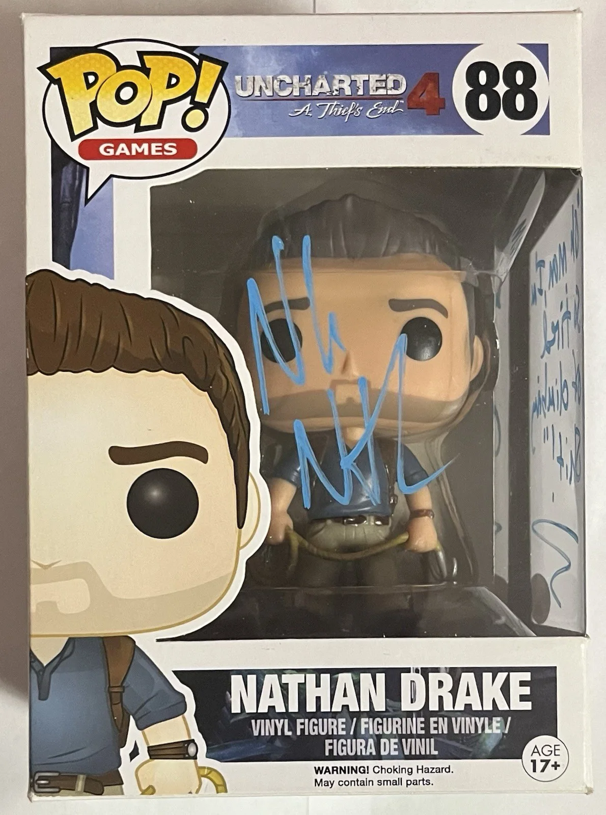 Nolan North — Nolan North Signed Nathan Drake Uncharted Funko Pop With Quote w/ JSA COA