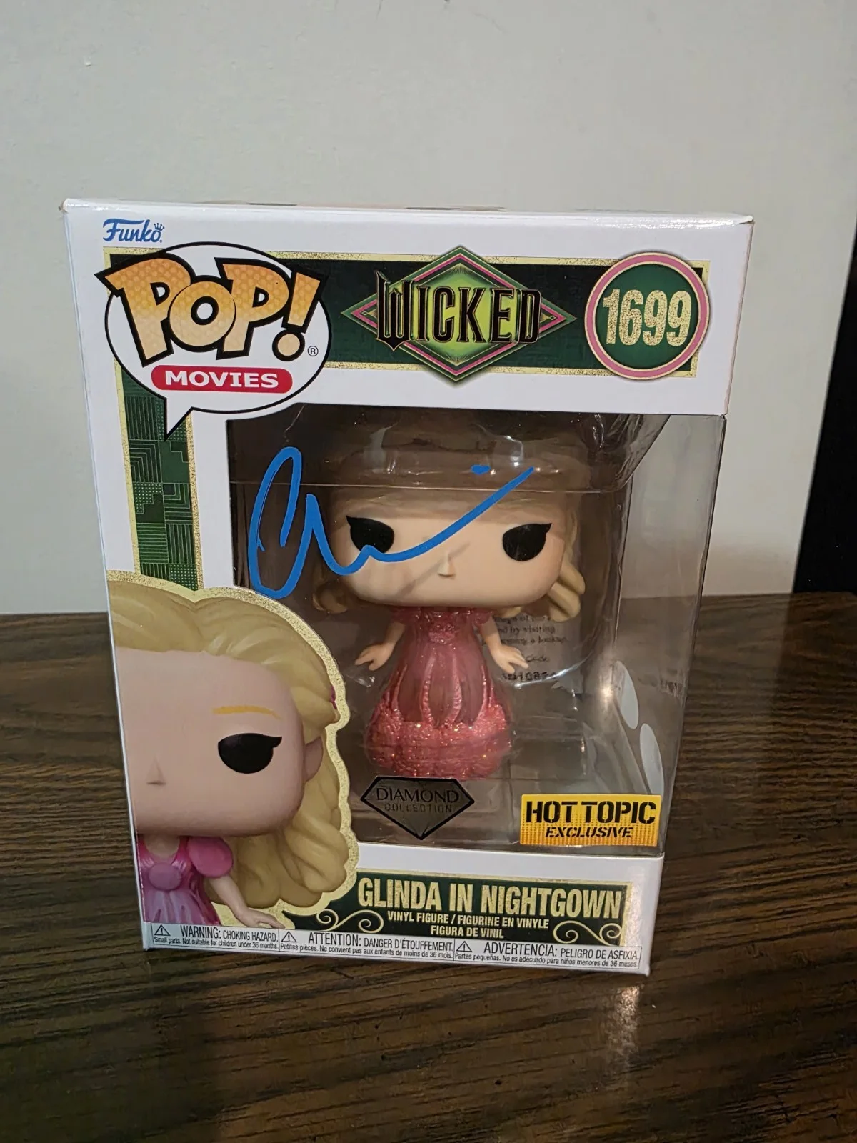 Ariana Grande — Ariana Grande Signed Glinda Funko Hot Topic Exclusive - JSA & ACOA Certified