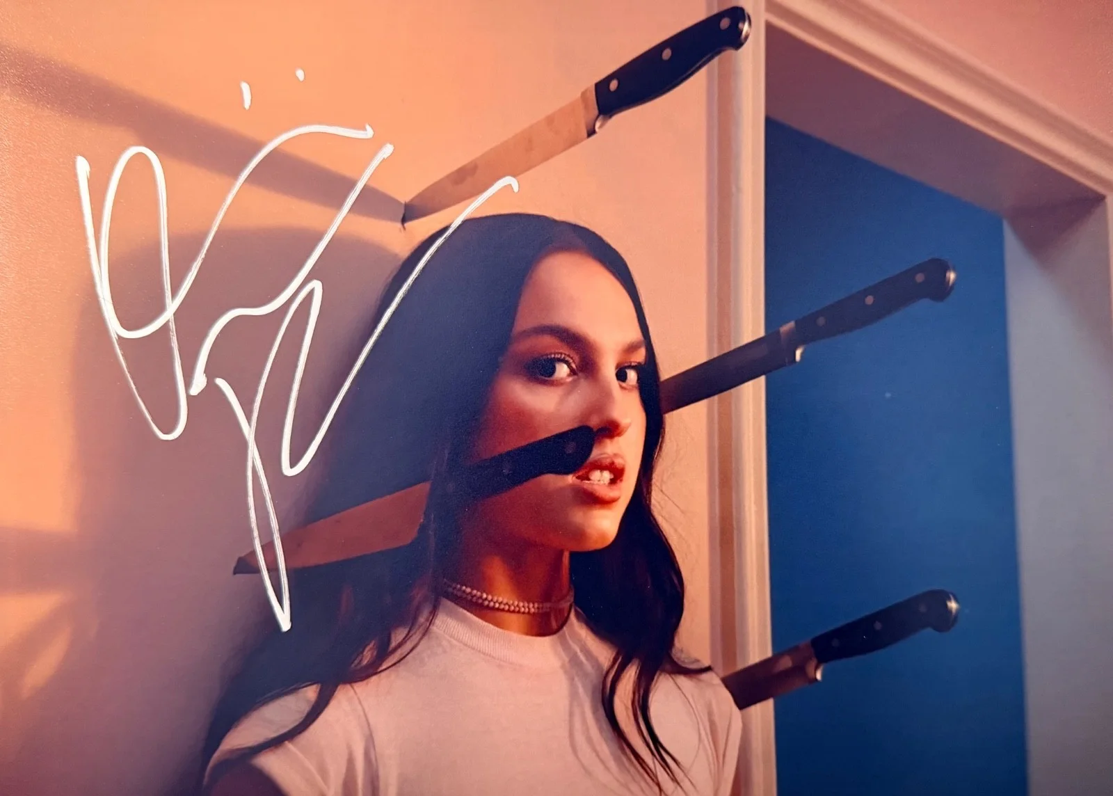 Olivia Rodrigo — Olivia Rodrigo Signed 8x11.5 Photo – Pop Star Sensation – Knife Scene – COA
