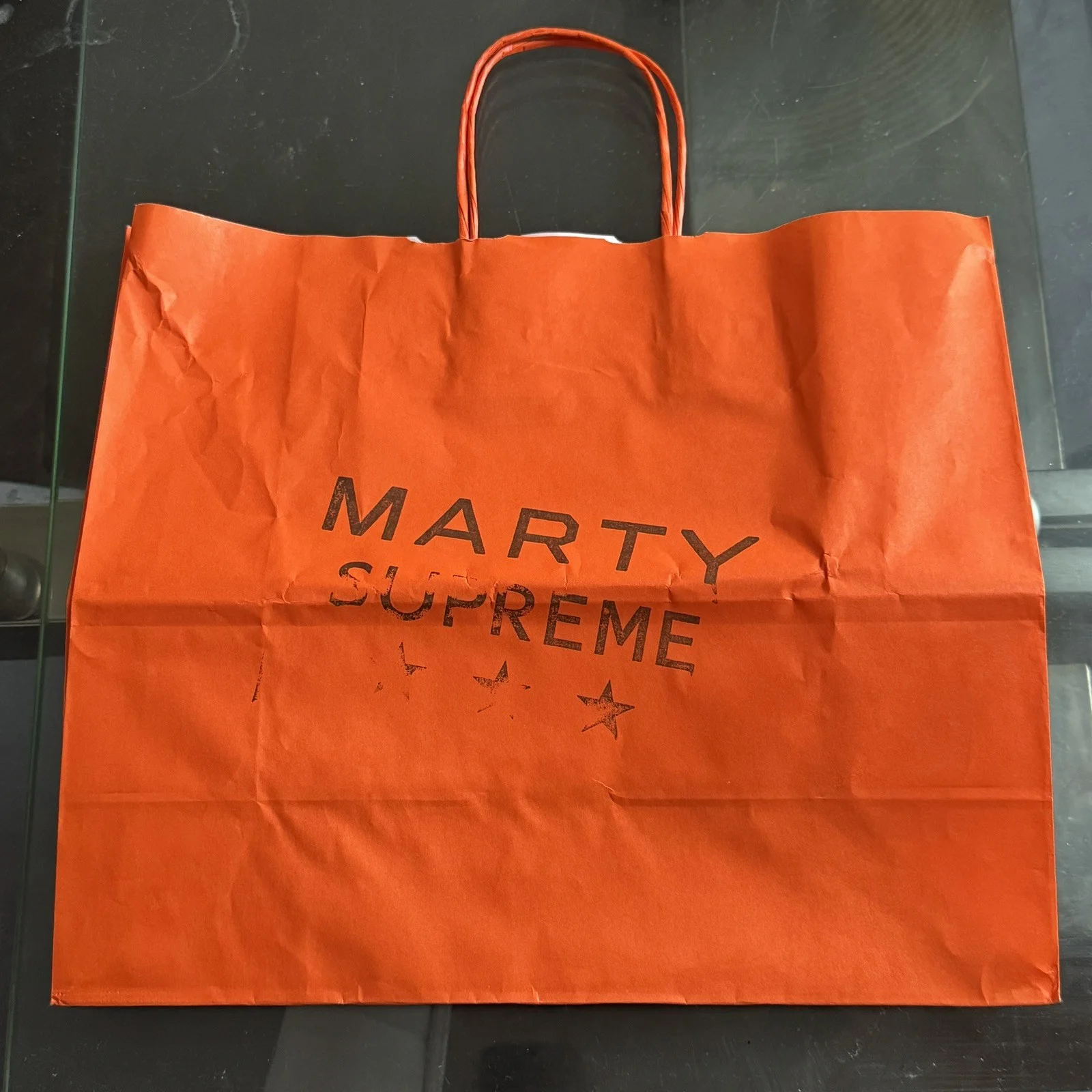 Marty Supreme London Pop Up Orange Bag And Apparel Menu Card By A24 Nahmias, изображение 2