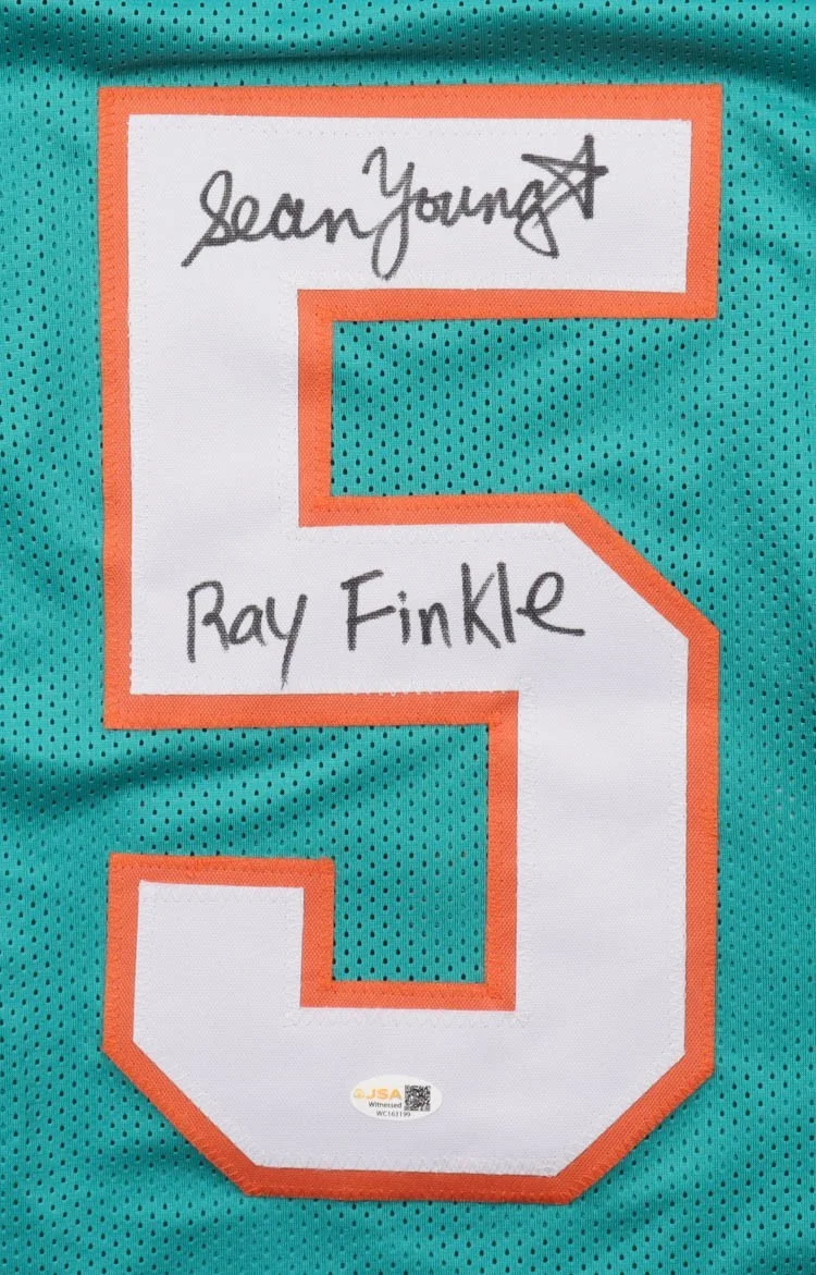 Sean Young / Lt. Lois Einhorn / Ray Finkle — Sean Young Signed Jersey Inscribed "Ray Finkle" (JSA) Ace Ventura / Dolphins, image 2