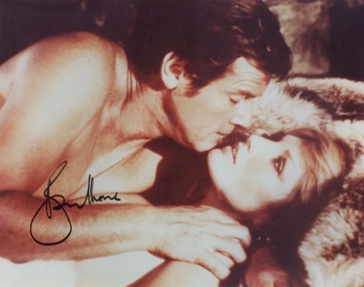 ROGER MOORE — ROGER MOORE SIGNED PHOTO FROM THE 1977 JAMES BOND FILM THE SPY WHO LOVED ME