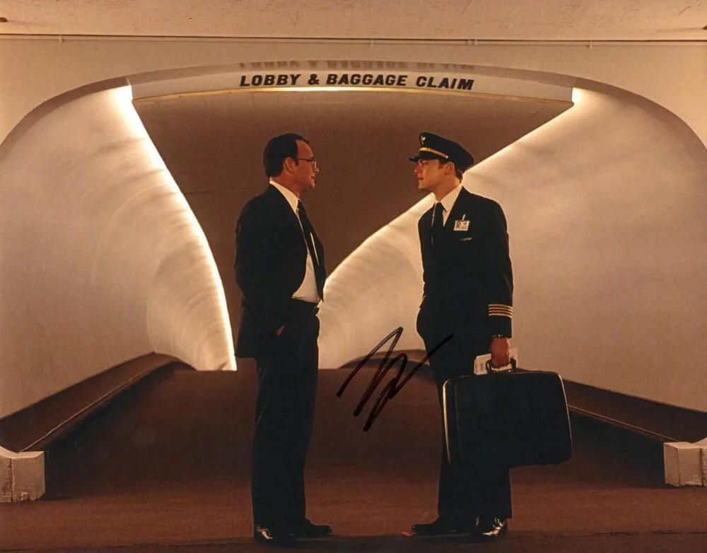 Leonardo DiCaprio — Leonardo DiCaprio Signed Autograph 11x14 Photo Catch Me If You Can w/ Tom Hanks