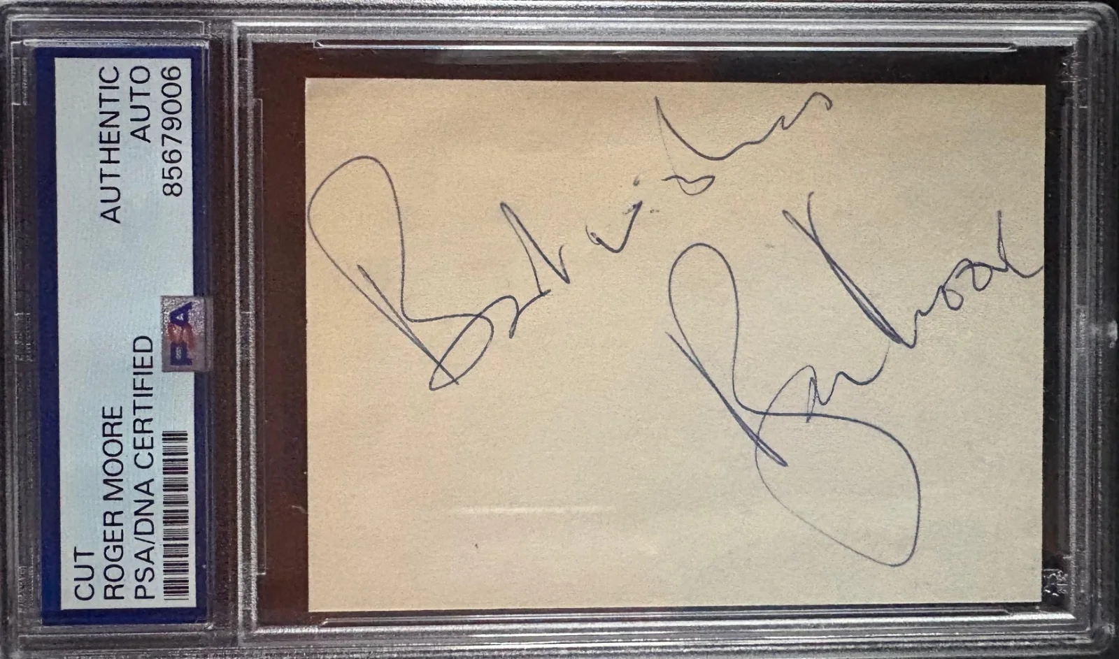 Roger Moore — ROGER MOORE SIGNED CUT PSA ENCAPSULATED JAMES BOND LIVE AND LET DIE BEST WISHES